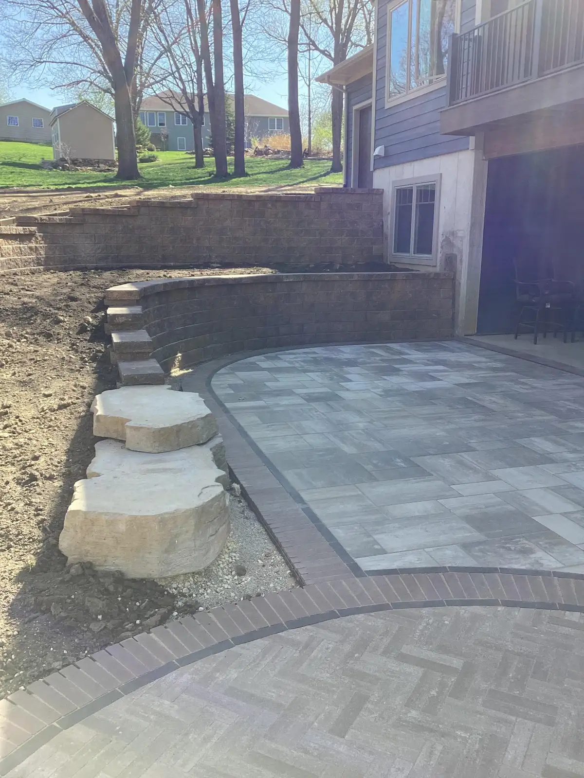 Professional landscape installation on a residential property near Independence Iowa
